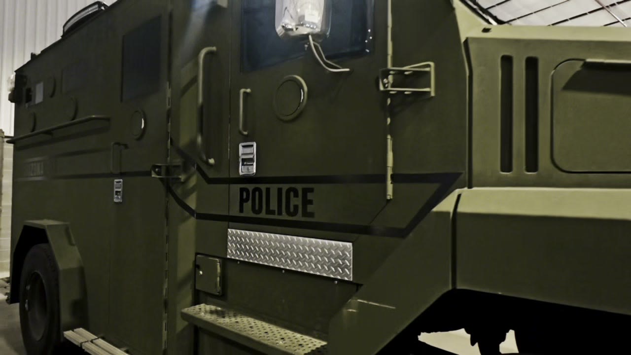 An agency armored vehicle in its vehicle bay, from the state-level agency interview